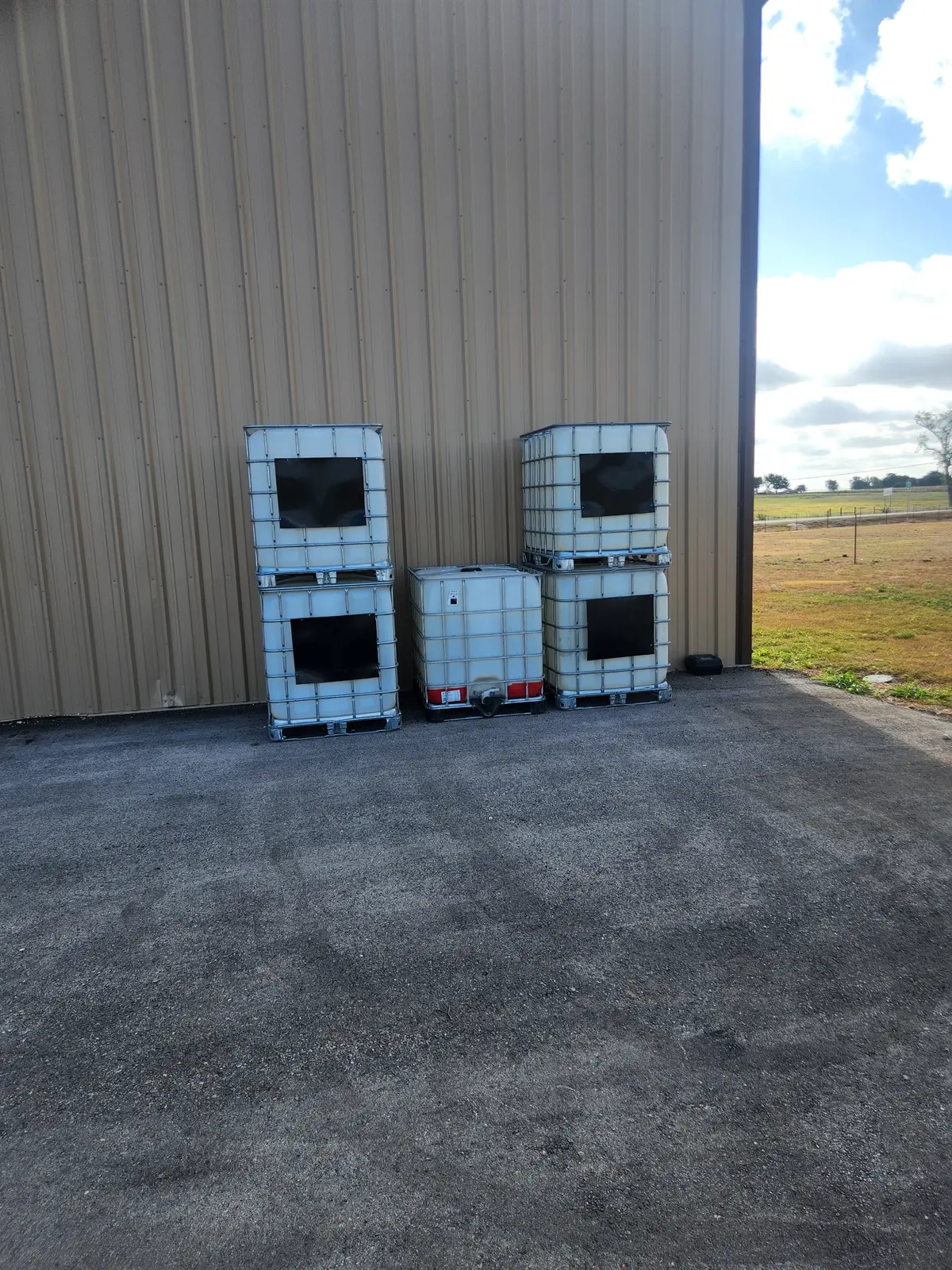 Used 275-Gallon 2" Ball Valve Steel Cage IBC Totes - Hutto, TX 78634